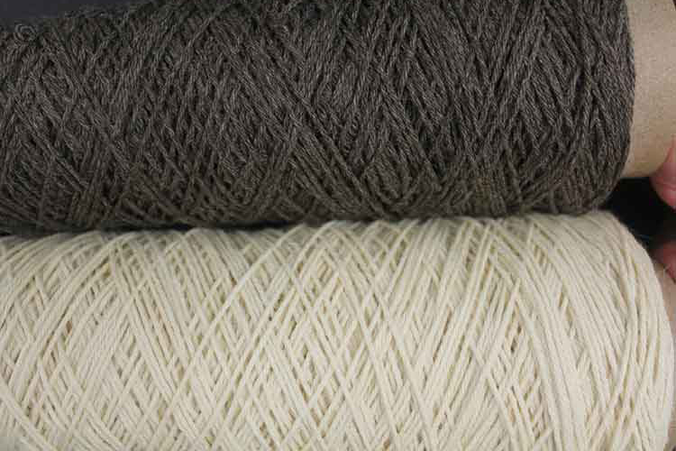  two spools of strong/broad merino wool